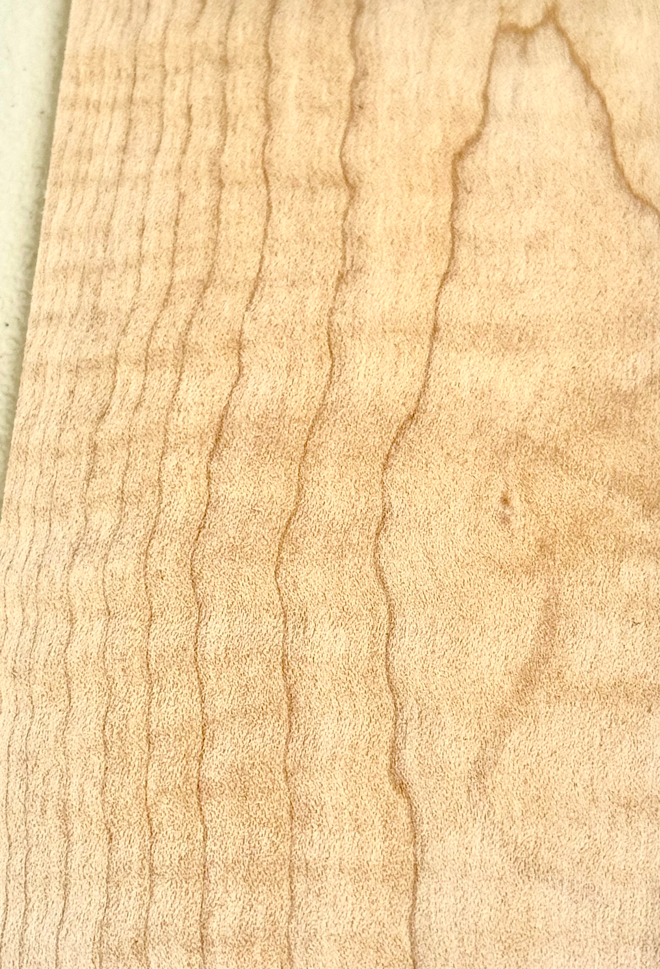 Curly Maple is not actually a species, but simply a description of a figure in the grain—it occurs most often in soft maples, but is also seen in hard maples. It is so called because the ripples in the grain pattern create a three dimensional effect that appears as if the grain has “curled” along the length of the board.